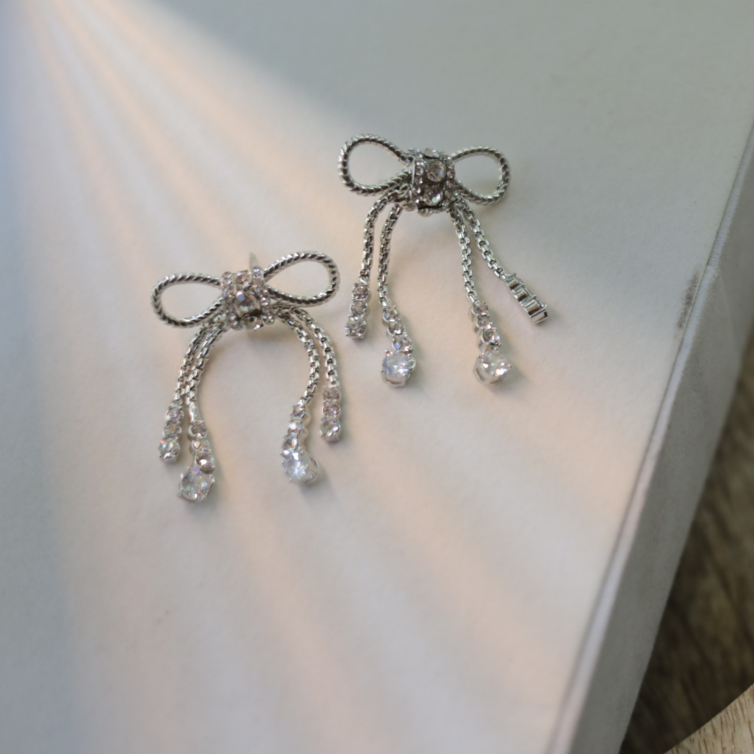 The Diamanté Bow Tassel Earrings