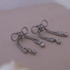 The Diamanté Bow Tassel Earrings