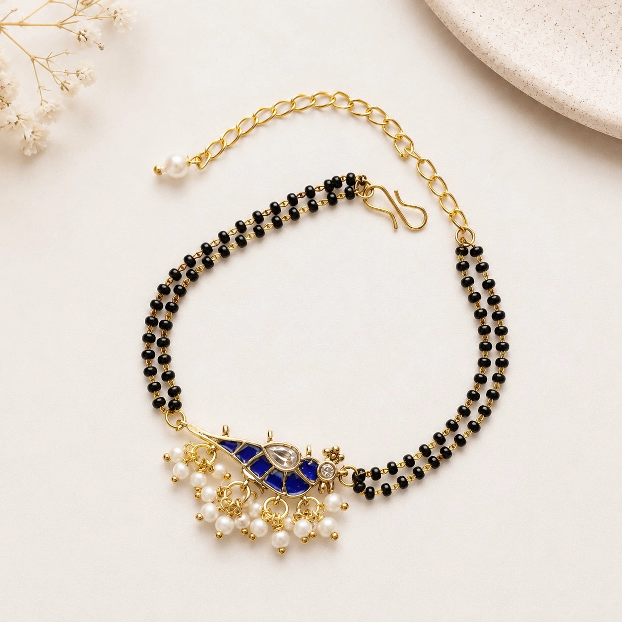 Handcrafted Double Layer Black Bead Hand Mangalsutra In Paachi Kundan Bird Charm
