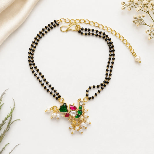 Handcrafted Double Layer Black Bead Hand Mangalsutra In Paachi Kundan Hen Charm
