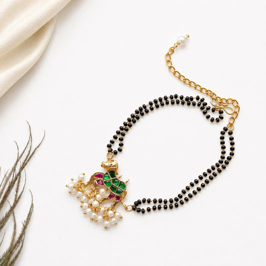 Handcrafted Double Layer Black Bead Hand Mangalsutra In Paachi Kundan Horse Charm